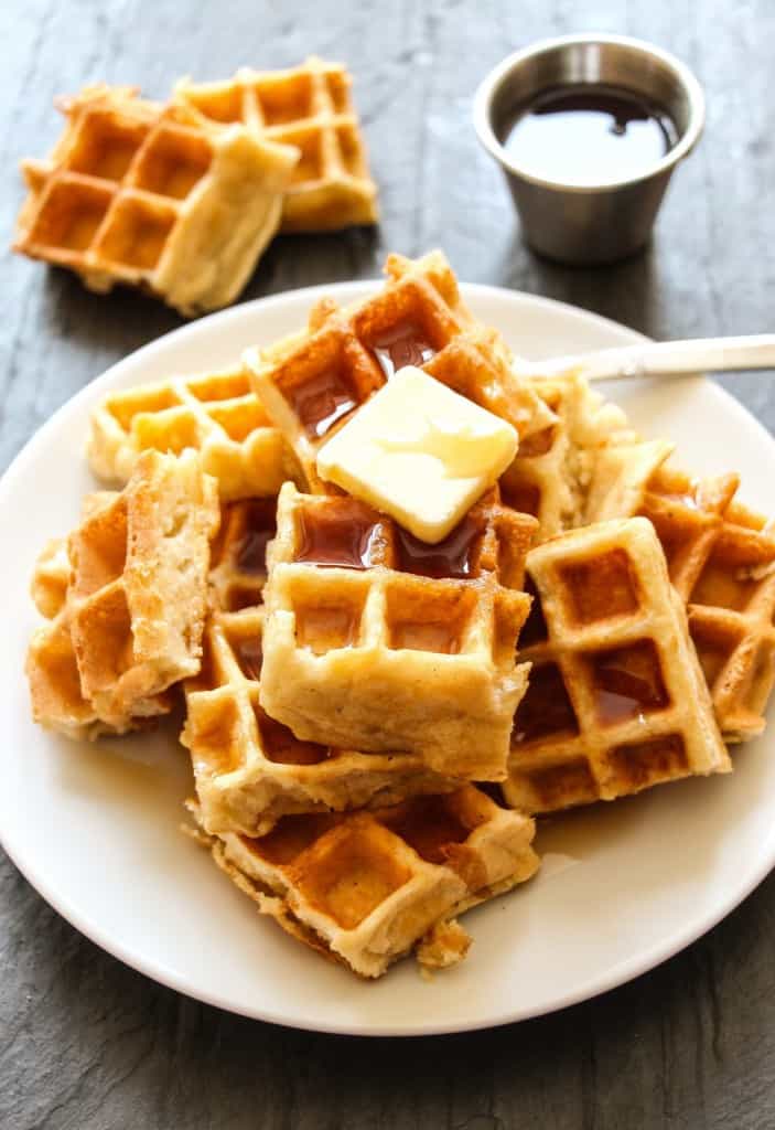 Gluten Free Belgium Waffles topped with butter and maple syrup