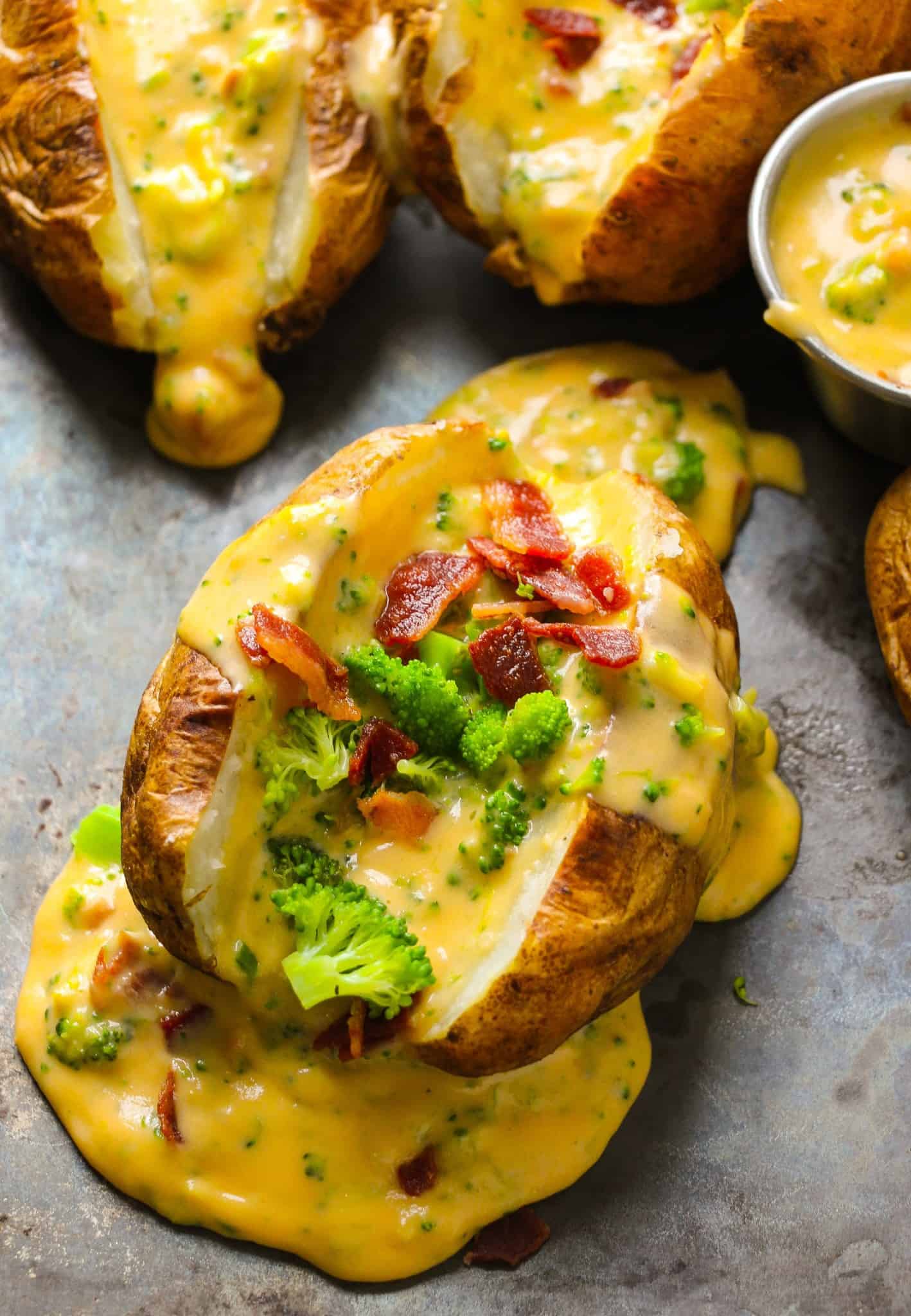 Loaded baked potatoes with broccoli cheddar cheese sauce