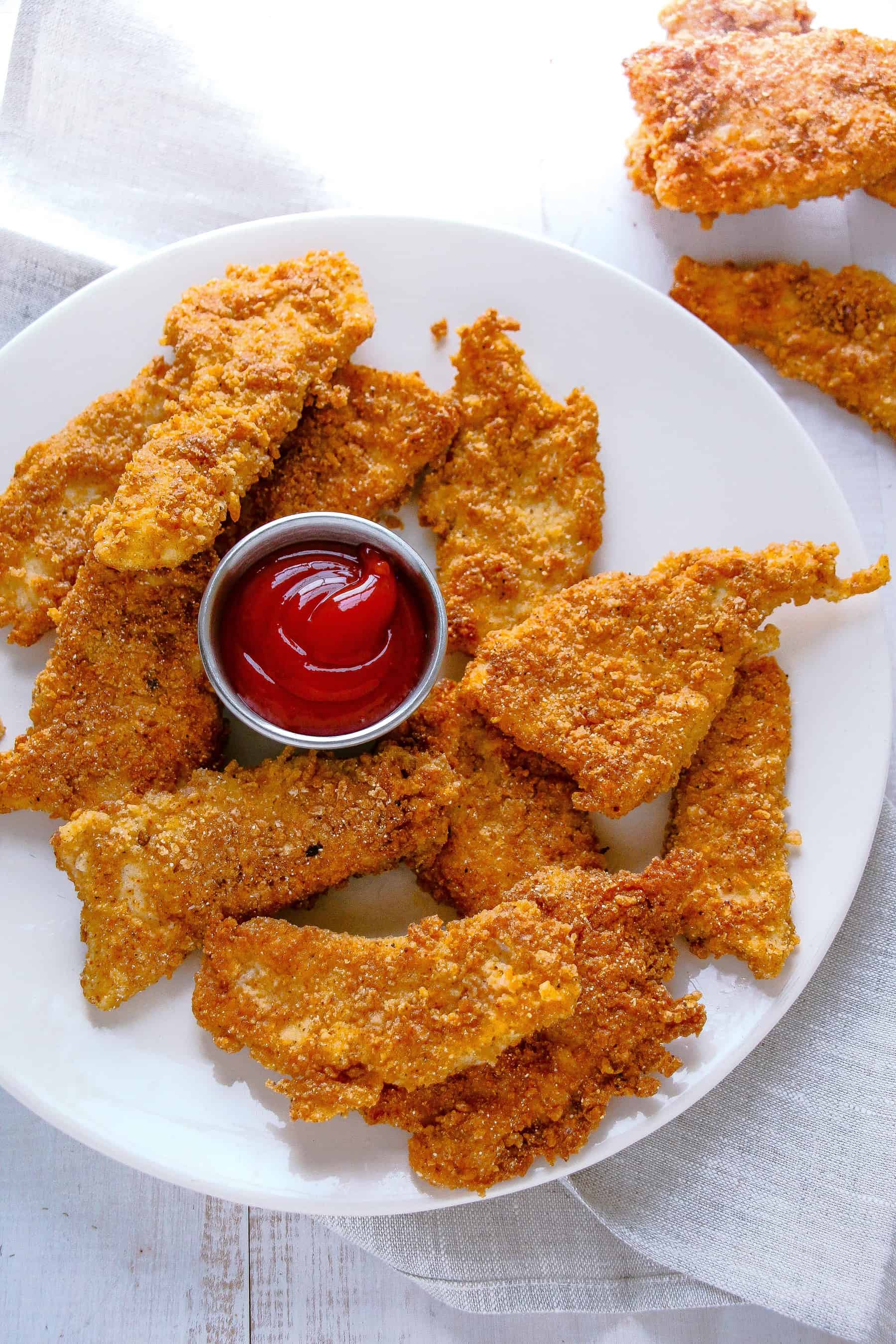 Homemade Chicken Fingers served with ketchup