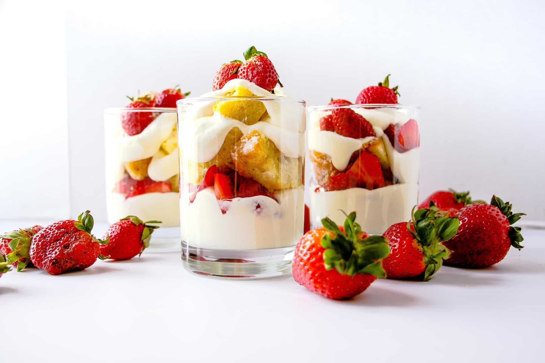 Strawberry shortcake cups layered with pudding, storebought cake, and fresh strawberries