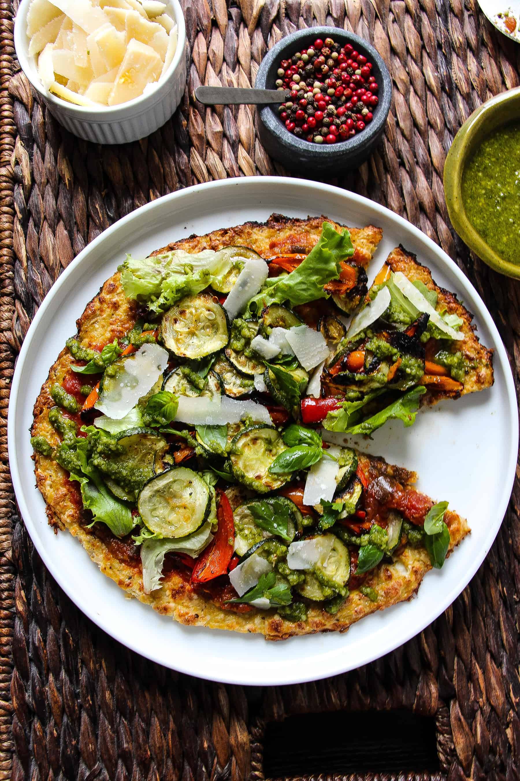 Perfect cauliflower crust with roasted vegetables and basil pesto