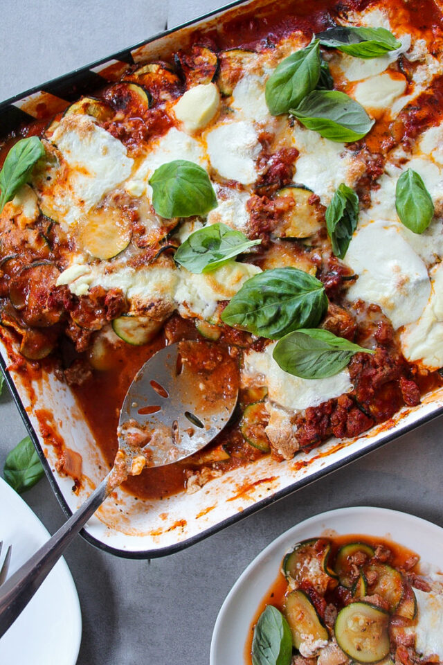 zucchini and sauce get layered with ricotta and parmesan, then baked with burrata!