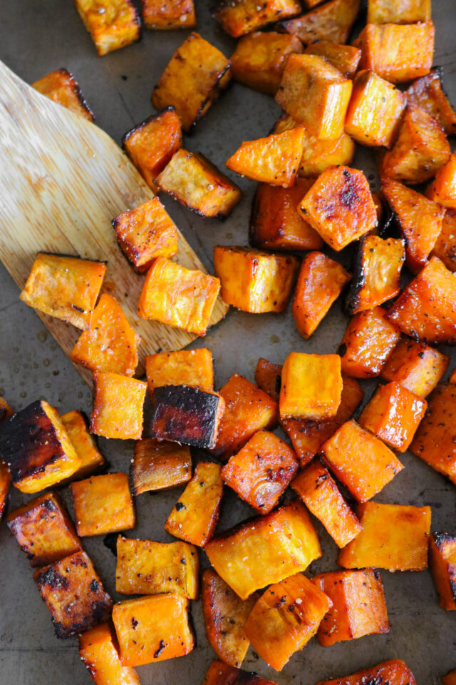 Oven roasted sweet potatoes on a baking sheet