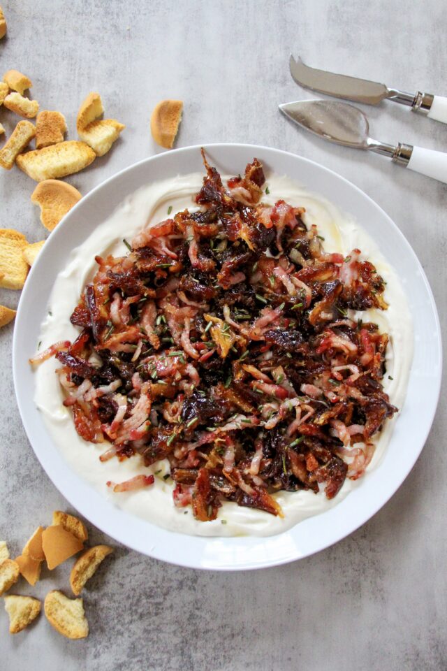 Plated whipped goat cheese with bacon and dates