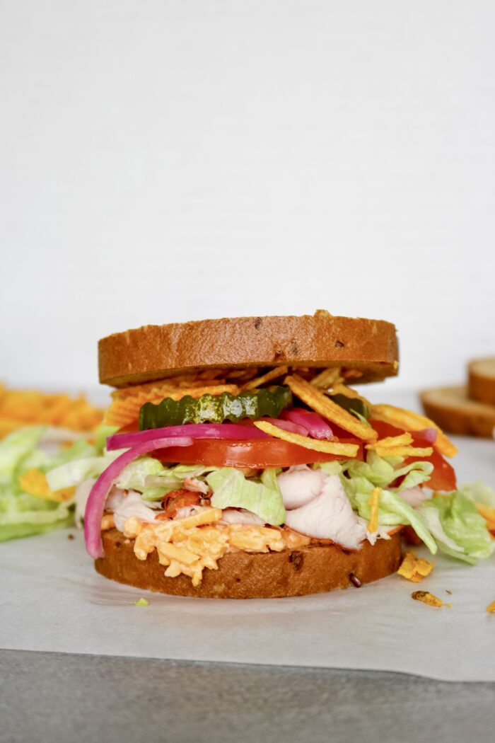 Side photo of summer sandwich recipe with all the fixings including pimento cheese