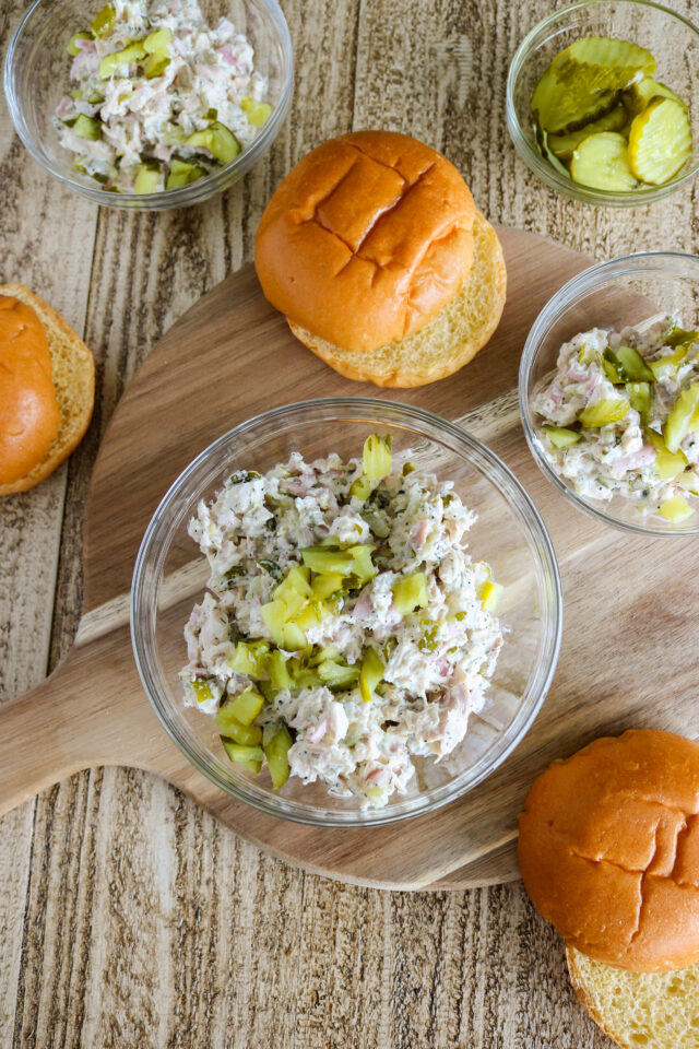 Overhead photo of dill pickle chicken salad with buns on the side