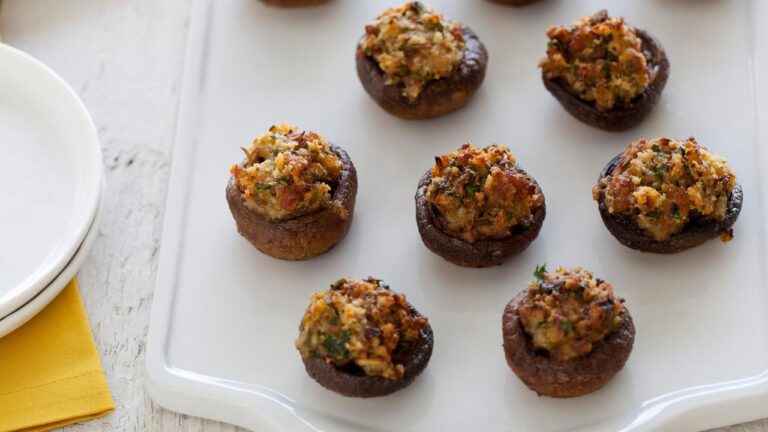Plated sausage stuffed mushrooms golden brown and out of the oven