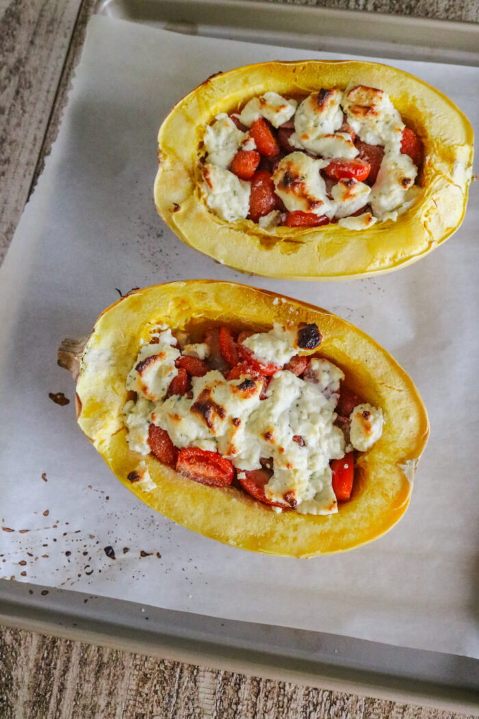 Baked boursin spaghetti squash boats out of the oven on a baking sheet